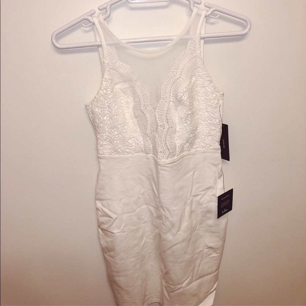 White fitted dress with sheer detailing